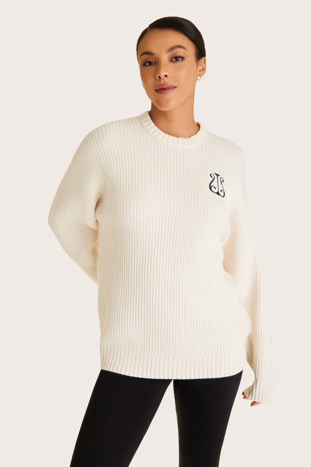 Alala women's white knit sweater with navy embroidered logo