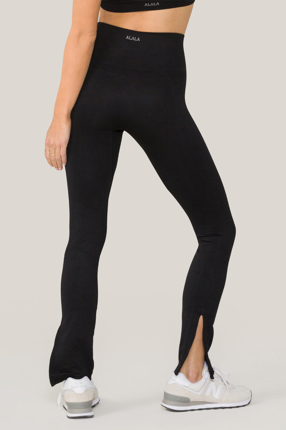 Alala women's seamless flare pant with slit in black