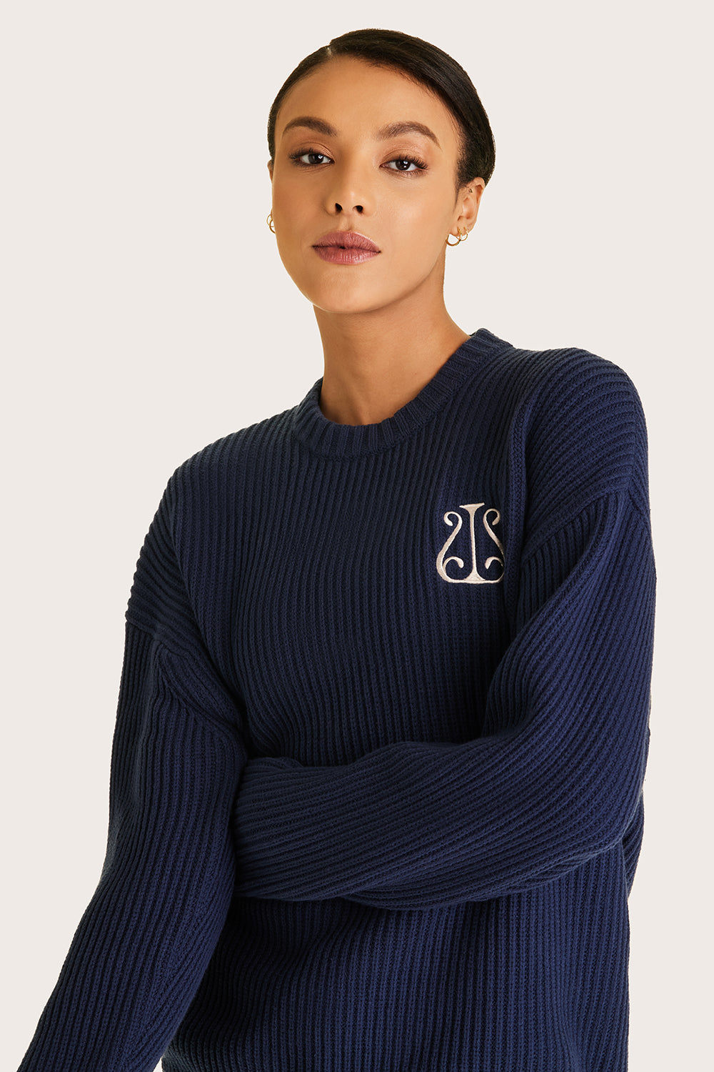 Alala women's navy knit sweater with white embroidered logo