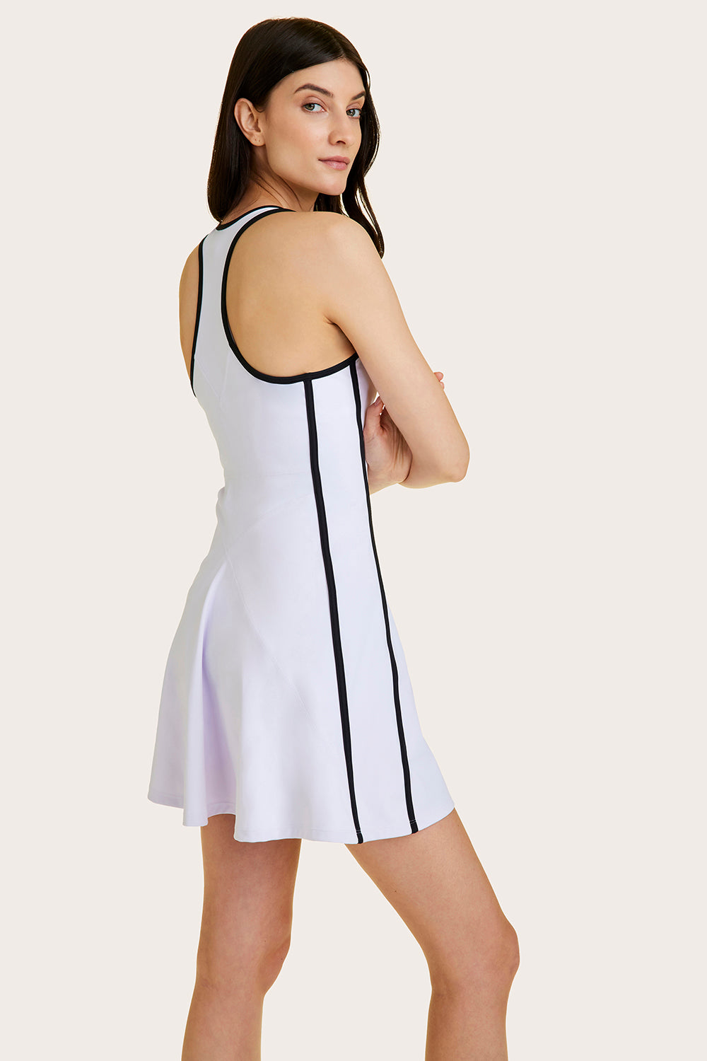 Alala women's tennis dress in white with black details