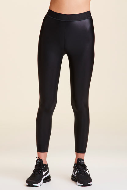 Front view of Alala Women's Luxury Athleisure shiny black tight