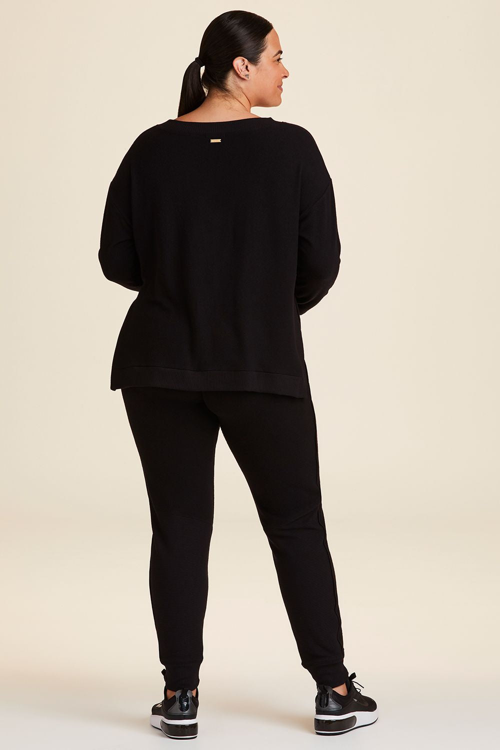 Full body back view of Alala Women's Luxury Athleisure wander sweatshirt in black