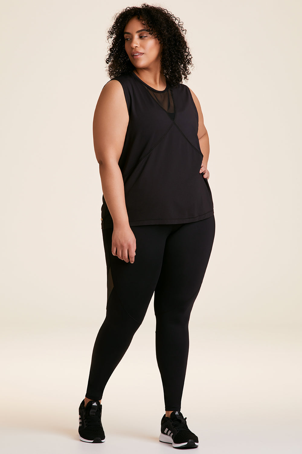 Front view of Alala Women's Luxury Athleisure black tank in plus size