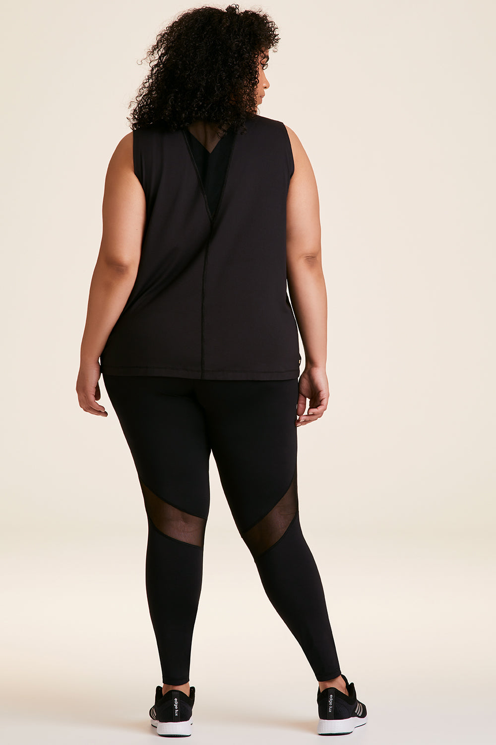 Back view of Alala Women's Luxury Athleisure black tank in plus size