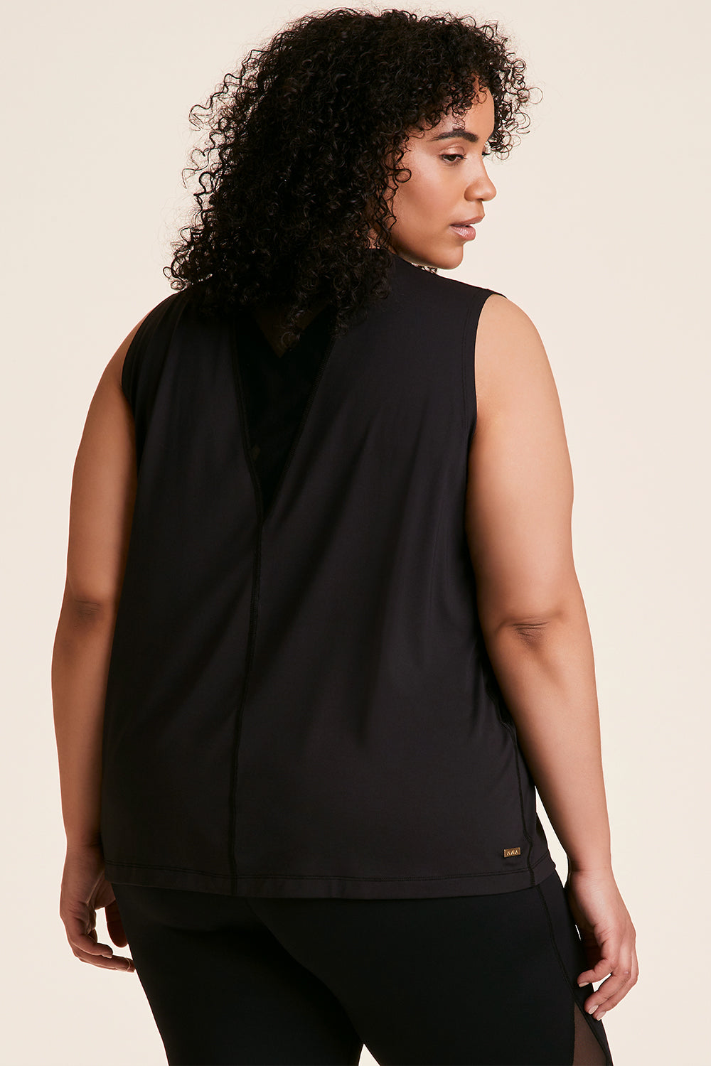 Back view of Alala Women's Luxury Athleisure black tank in plus size