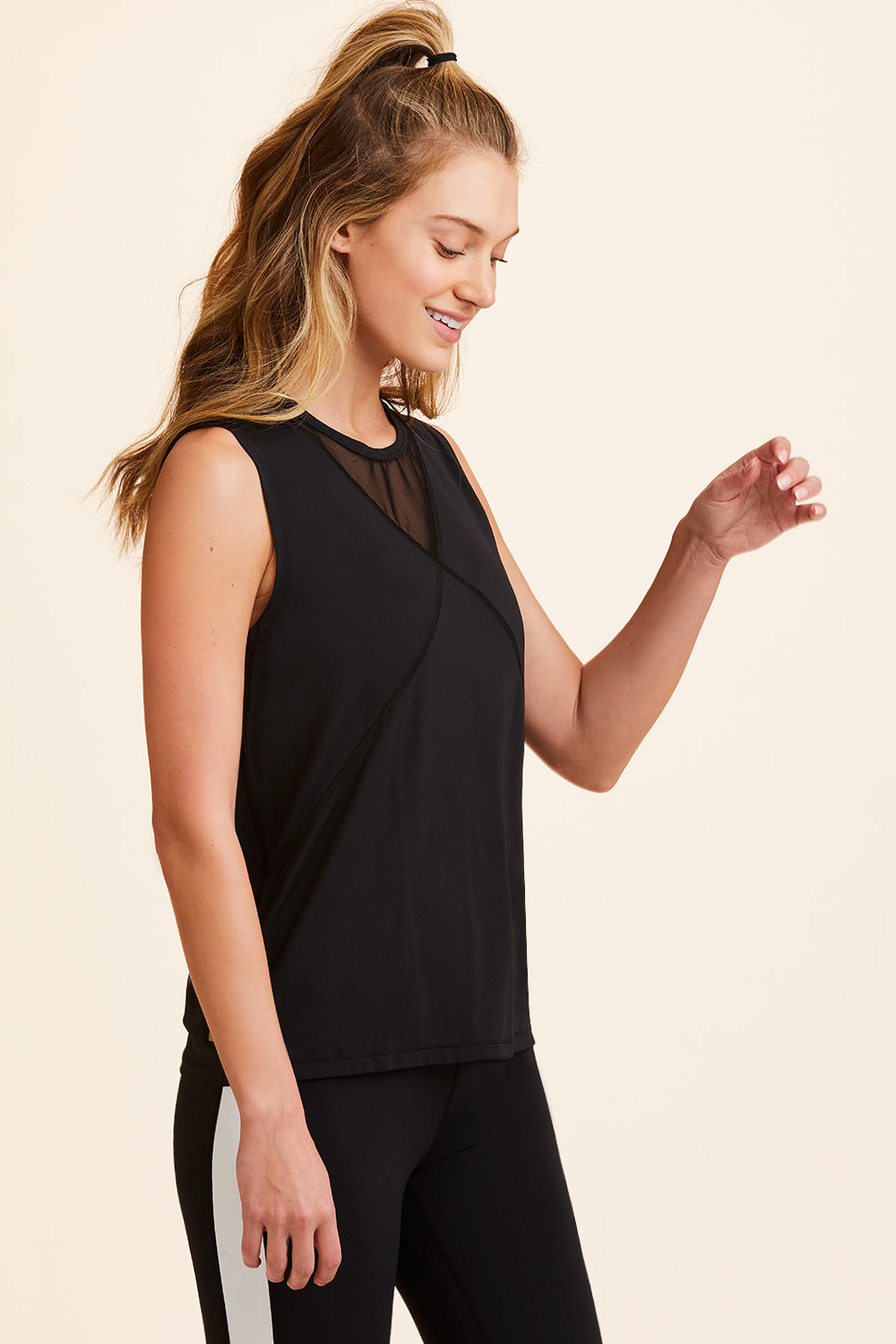 3/4 view of Alala Women's Luxury Athleisure black tank