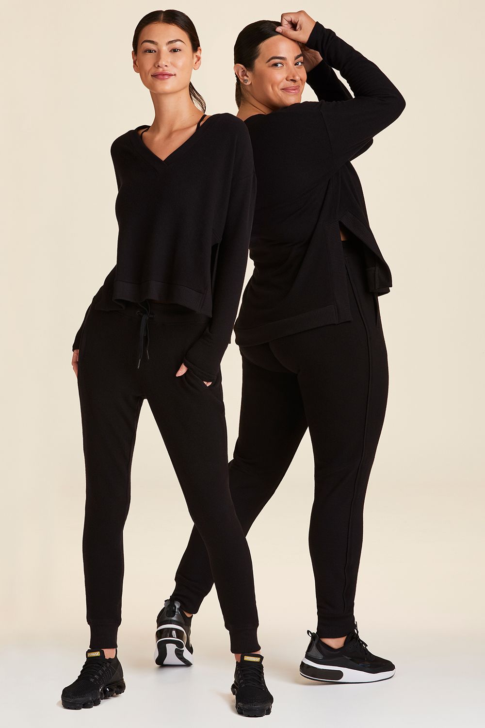 Full body front view of Alala Women's Luxury Athleisure wander sweatpant in black