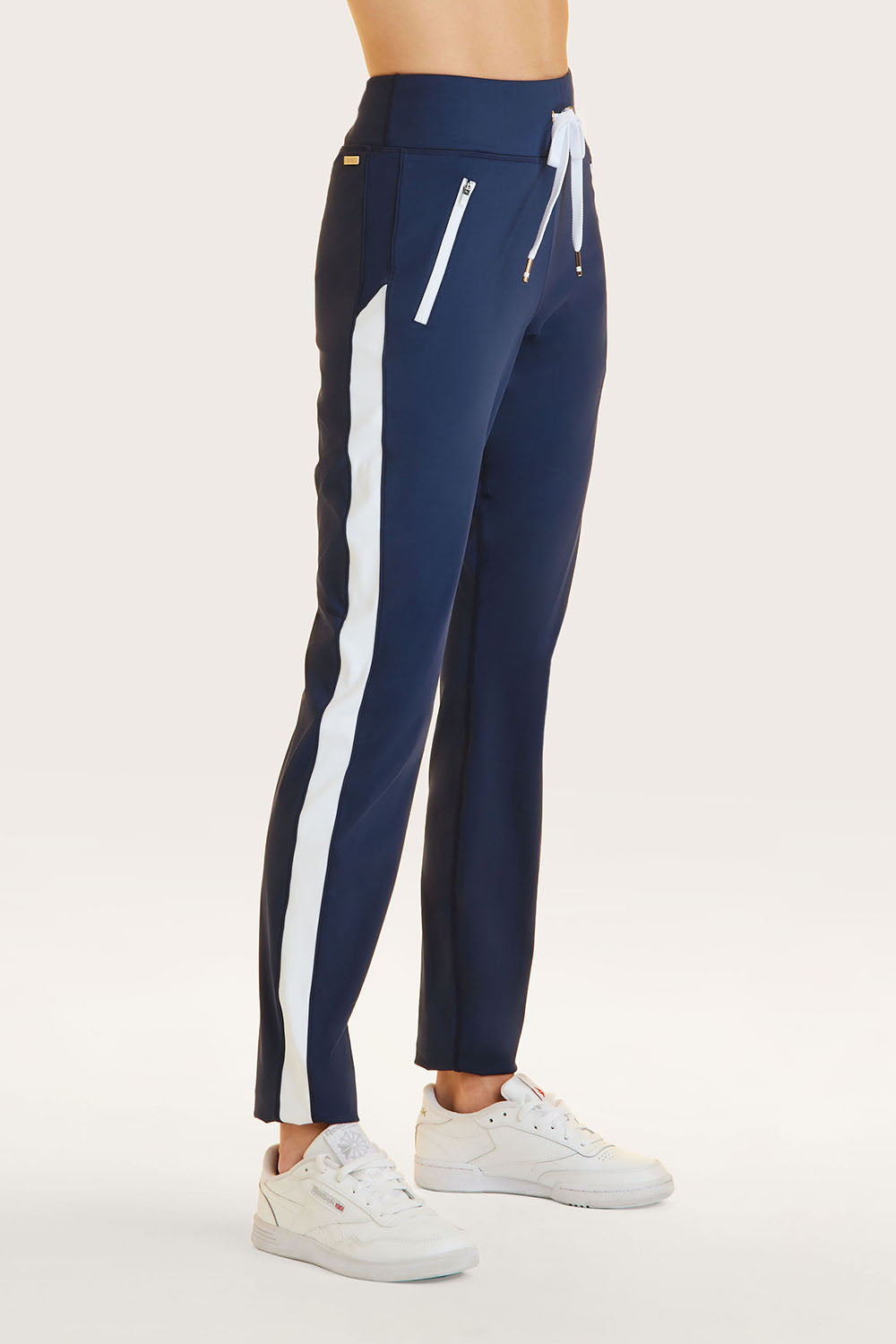 Alala women's active pant in navy with white stripe