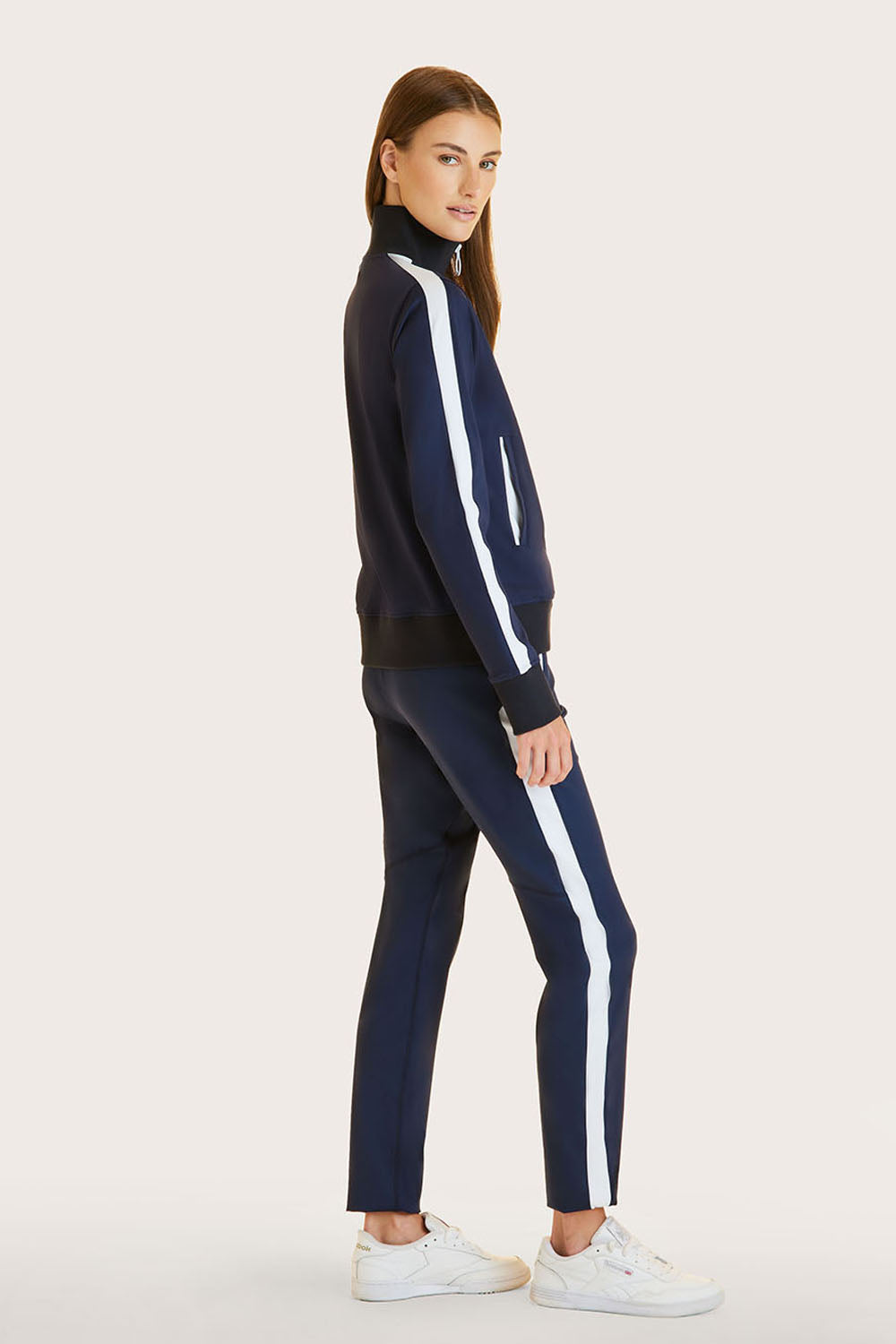 Alala women's active pant in navy with white stripe