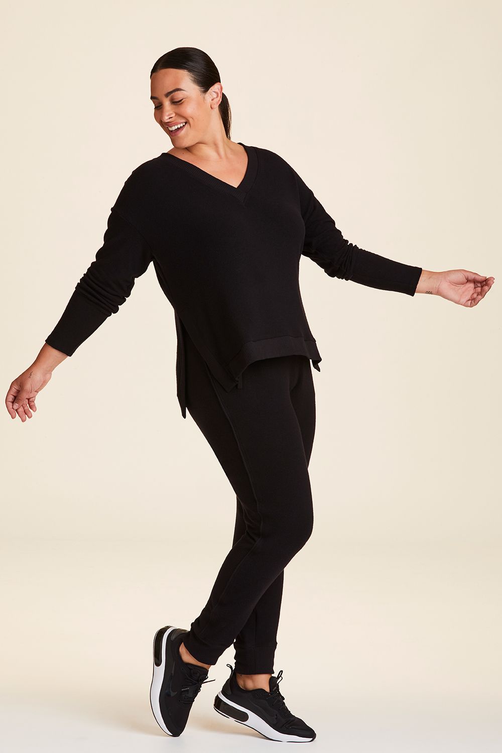 Full body side view of Alala Women's Luxury Athleisure wander sweatshirt in black