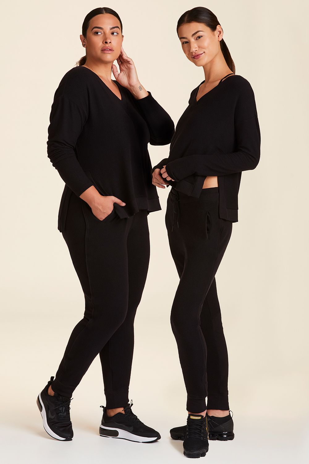 Full body side view of Alala Women's Luxury Athleisure wander sweatshirt in black