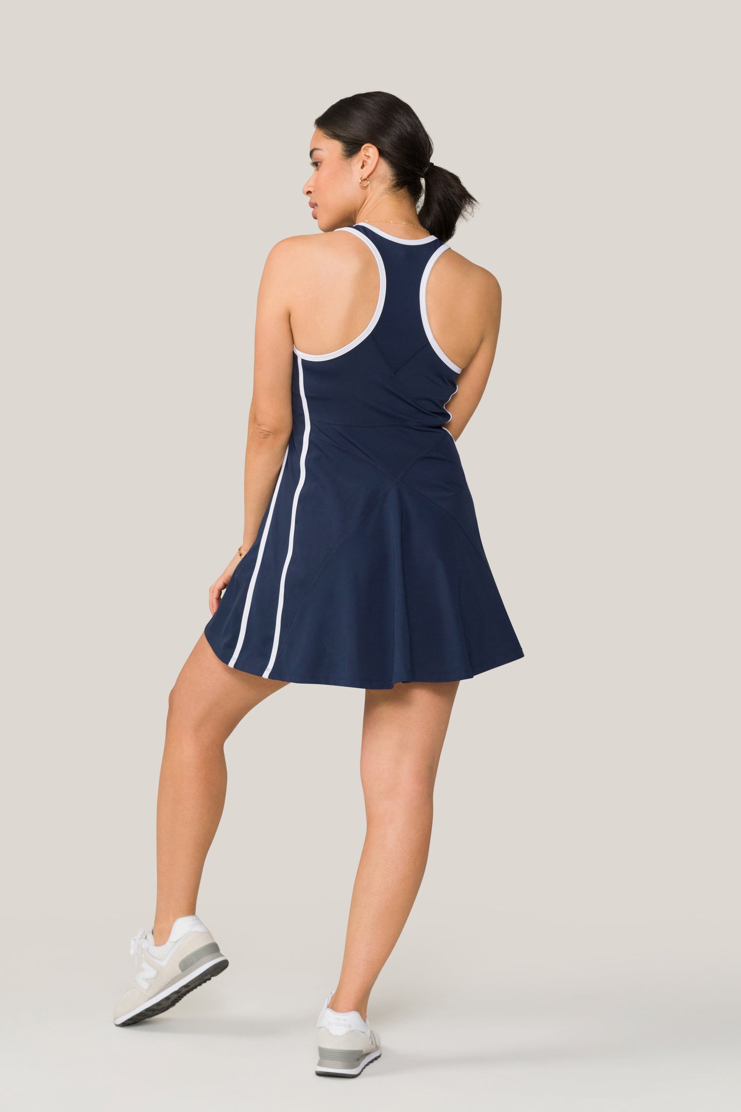 Alala women's tennis dress in navy with white details