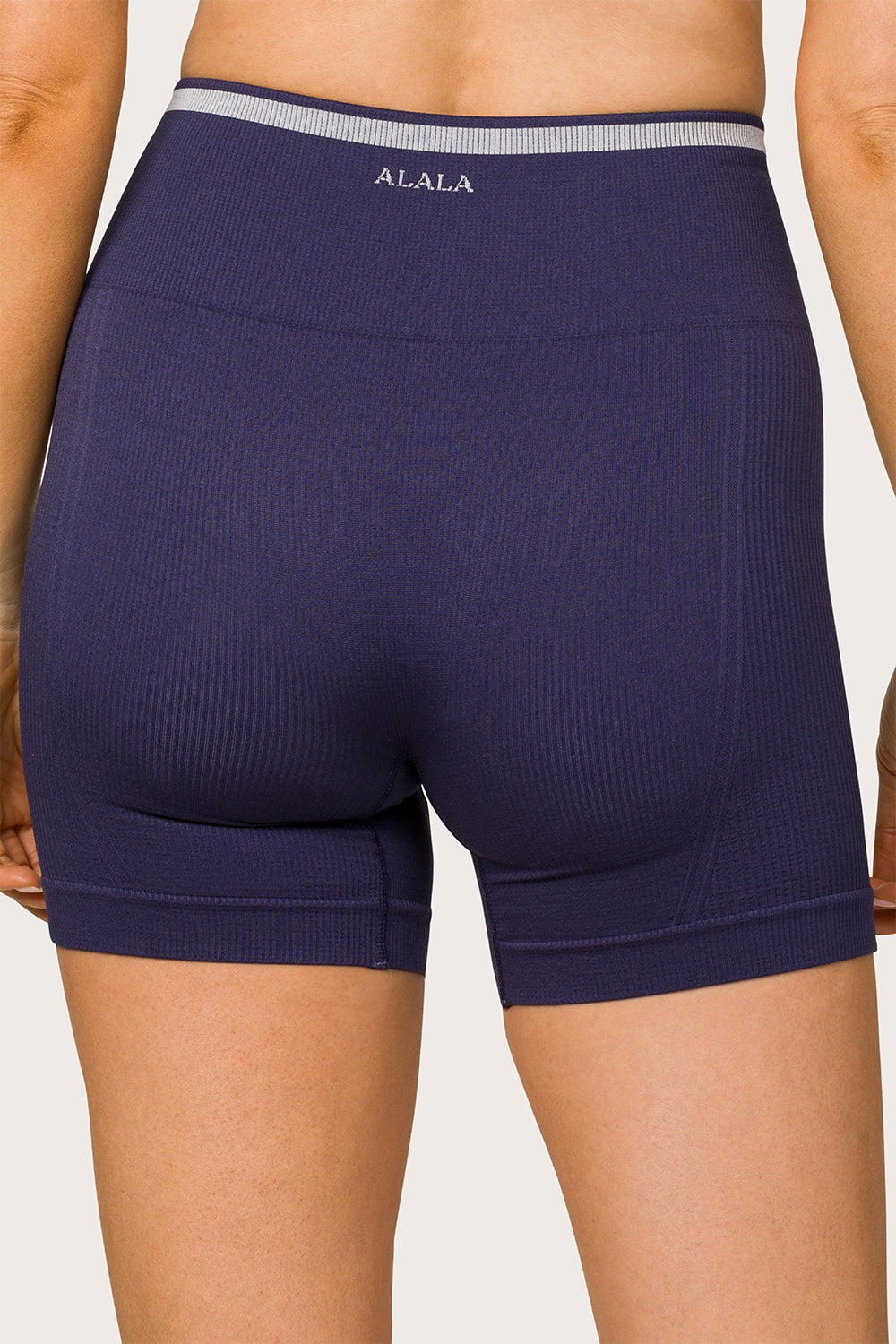 Alala women's barre seamless short in navy with white details