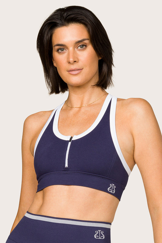 Alala women's seamless racerback bra with zipper in navy with white details
