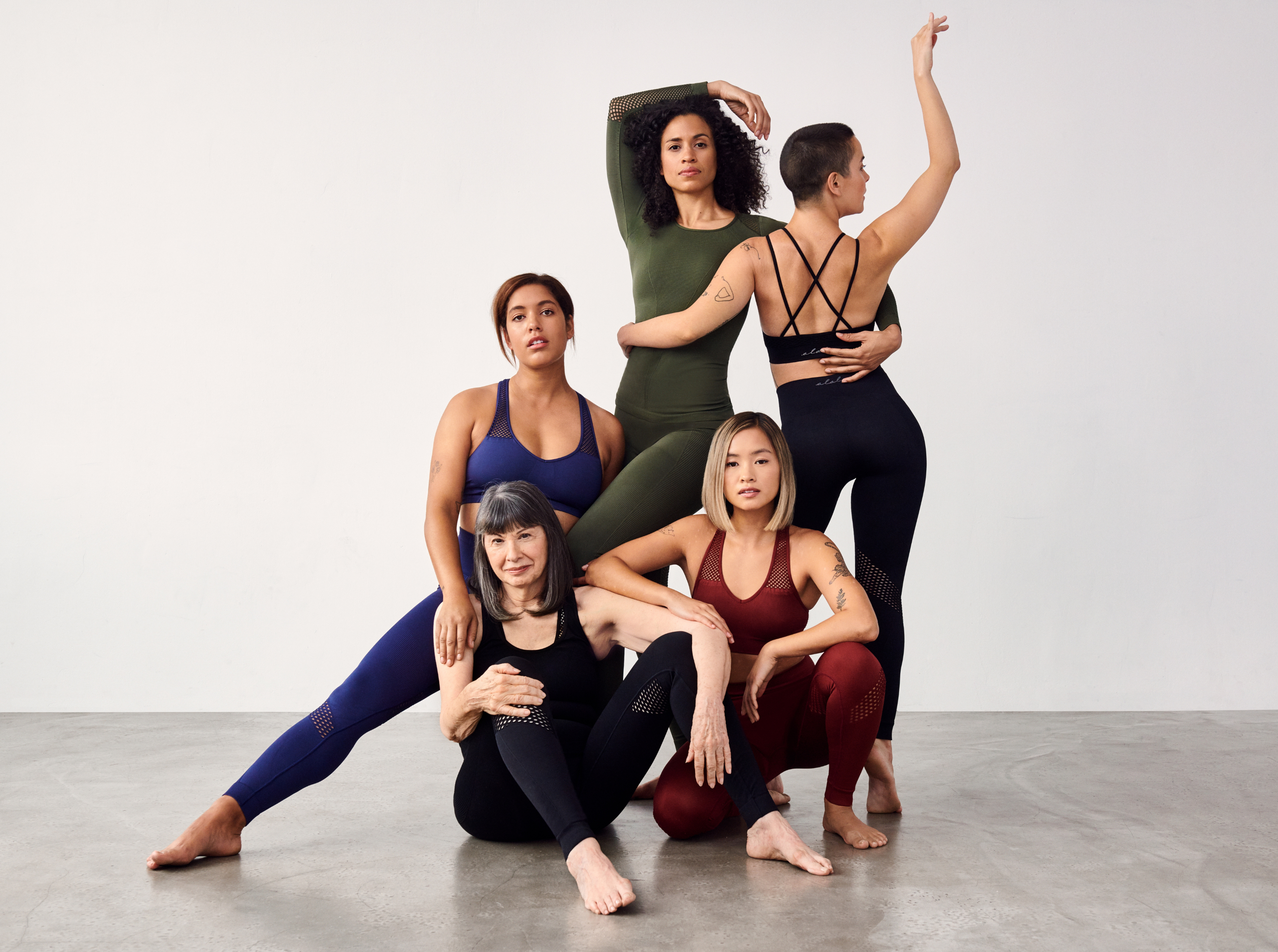 Women of diverse backgrounds wearing Alala workout sets. 