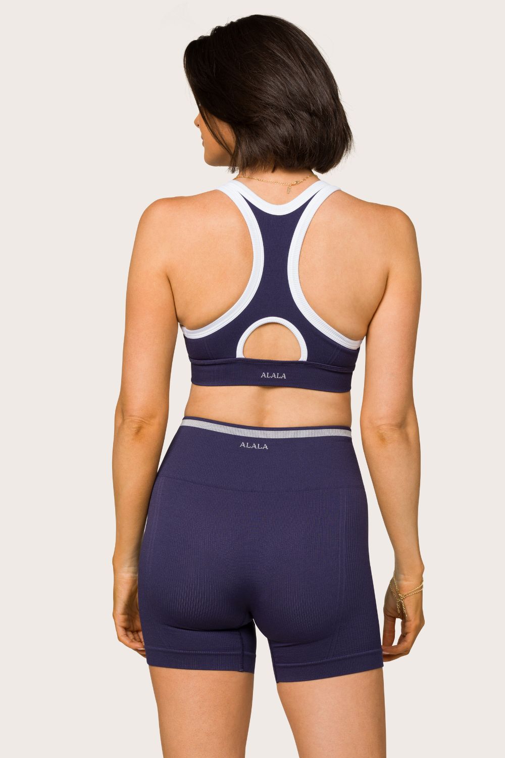 Alala women's barre seamless short in navy with white details