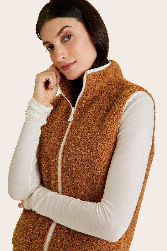 Alala women's reversible sherpa vest in beige and white