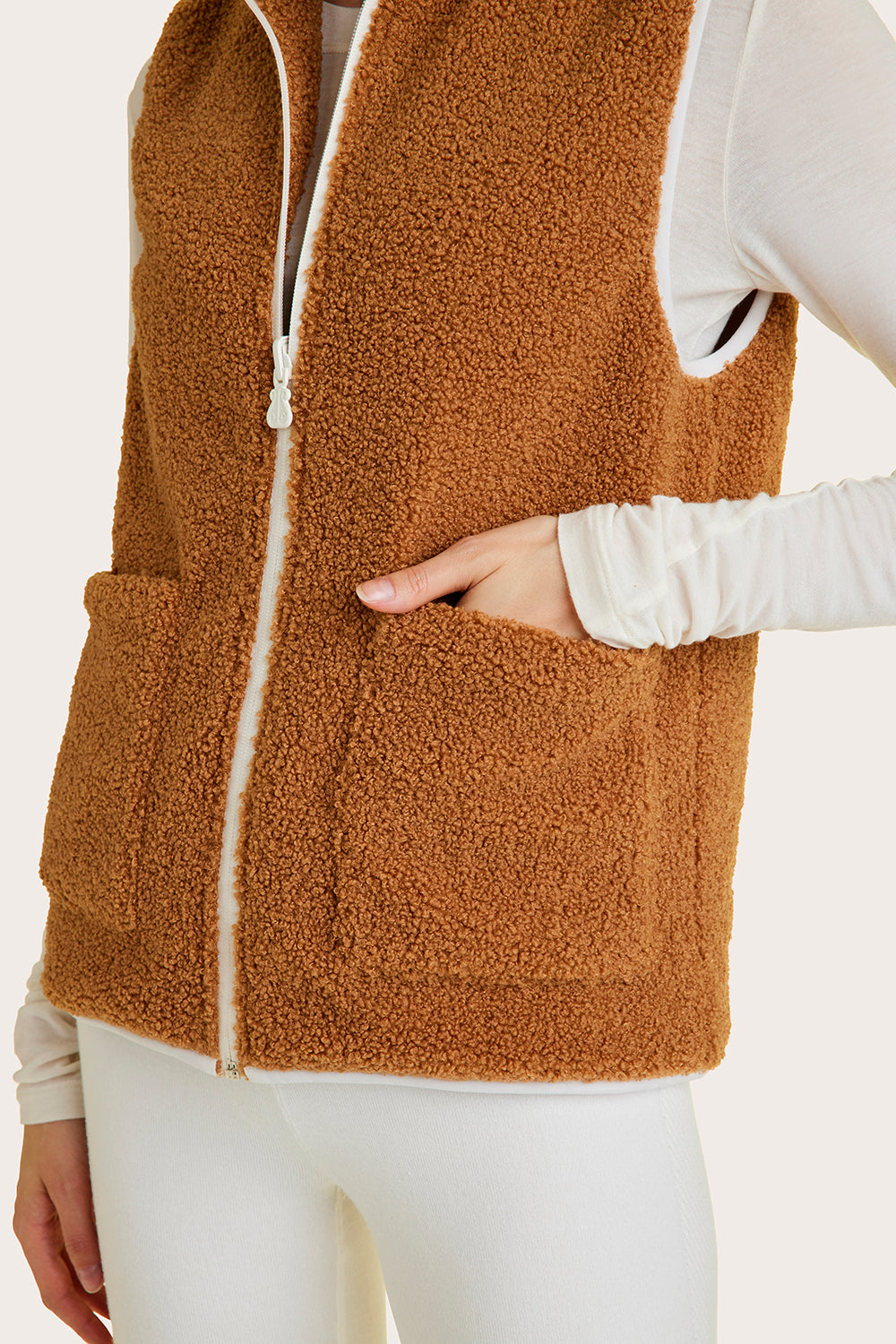 Alala women's reversible sherpa vest in beige and white