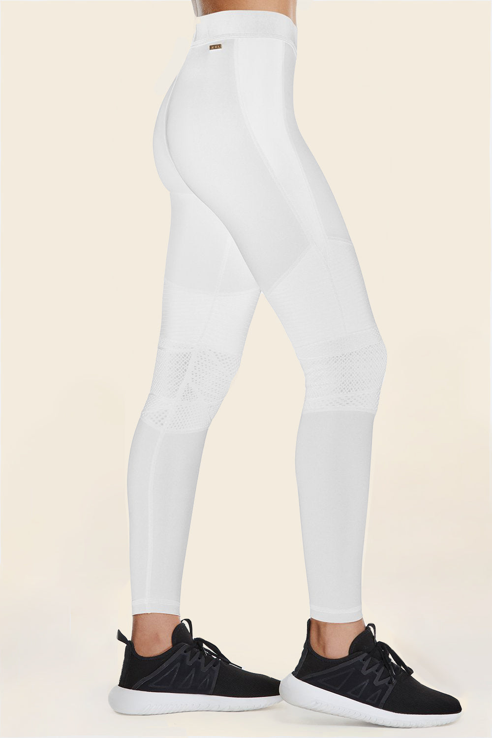 Side view of Alala Women's Luxury Athleisure harley tight in white with lace detailing