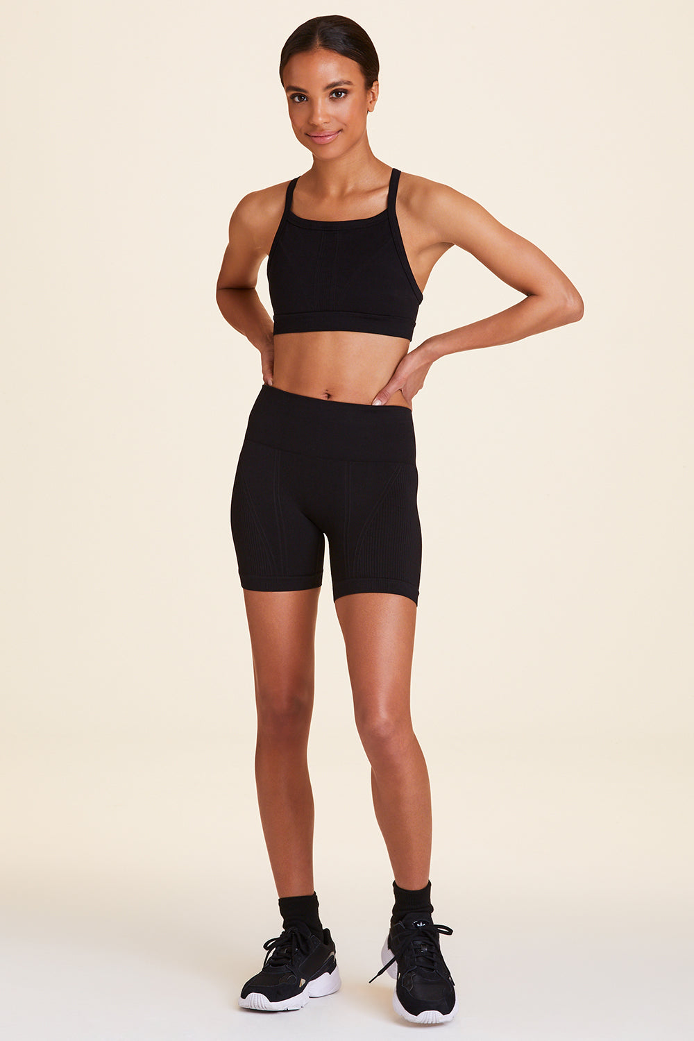 Full body front view of Alala Luxury Women's Athleisure barre seamless short in white