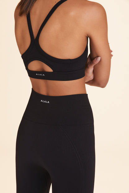 Back view of Alala Women's Luxury Athleisure black seamless tight