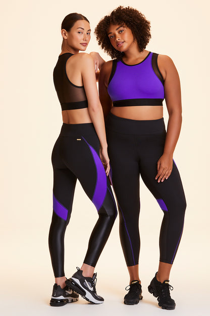 Front and side view of Alala Women's Luxury Athleisure black and purple color-blocked tight