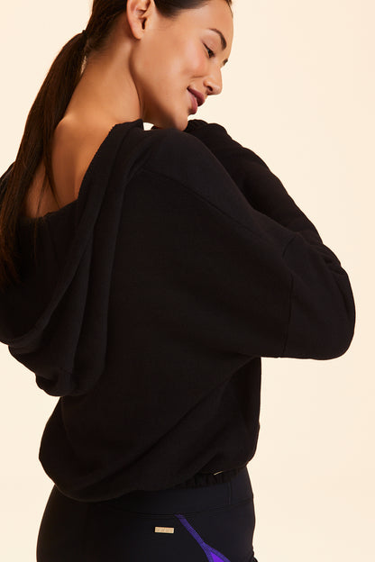 3/4 back view of Alala Women's Luxury Athleisure black cropped sweatshirt