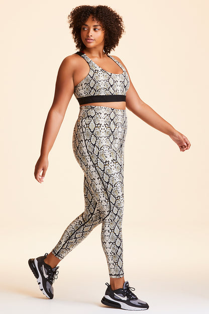 3/4 view of Alala Women's Luxury Athleisure snakeprint tight with mesh paneling on back of knees in plus size