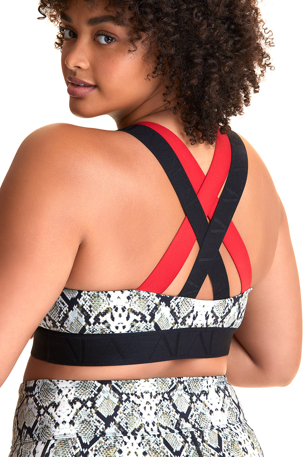 Back view of Alala Women's Luxury Athleisure snakeskin sports bra with red and black cross back straps in plus size
