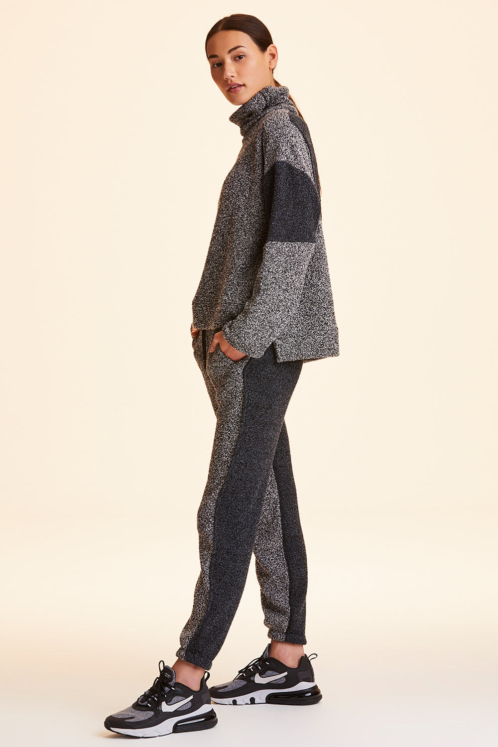 Side view of Alala Women's Luxury Athleisure heather grey marled yarn sweatpant
