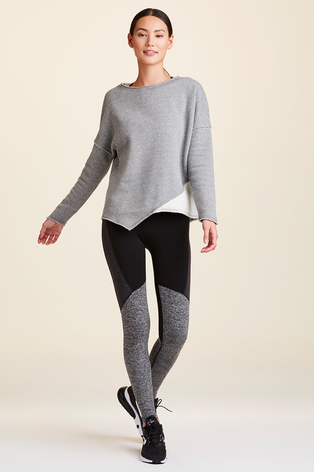 Front view of Alala Women's Luxury Athleisure grey sweatshirt with distressed details on seams