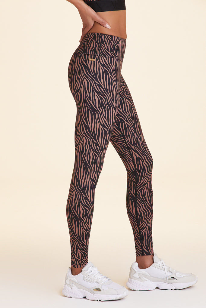Side view of Alala Women's Luxury Athleisure zebra print tight