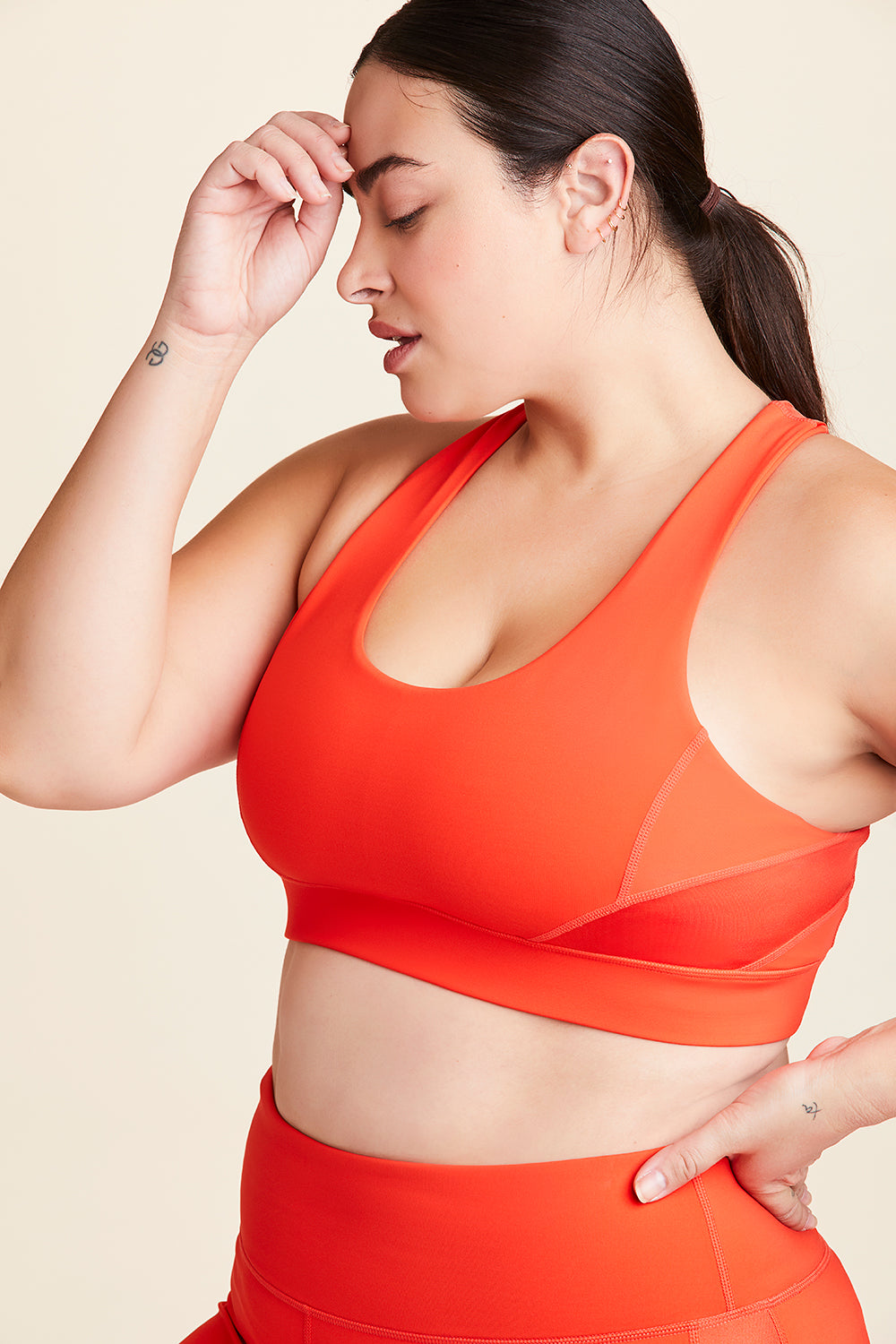 Front view of Alala Women's Luxury Athleisure lava colored sports bra