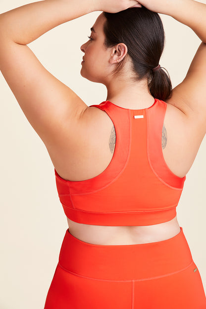 Back view of Alala Women's Luxury Athleisure lava colored sports bra