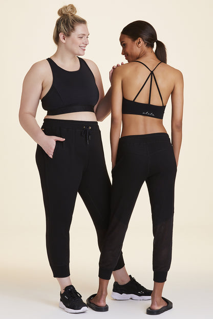 Front and back view of Alala Women's Luxury Athleisure black sweatpant