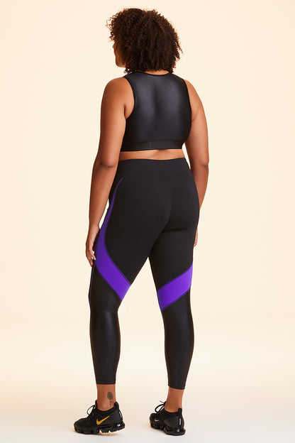 Back view of Alala Women's Luxury Athleisure black and purple color-blocked tight in plus size