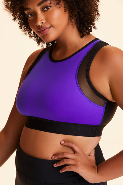 Close-up view of Alala Women's Luxury Athleisure black and purple color-blocked sports bra