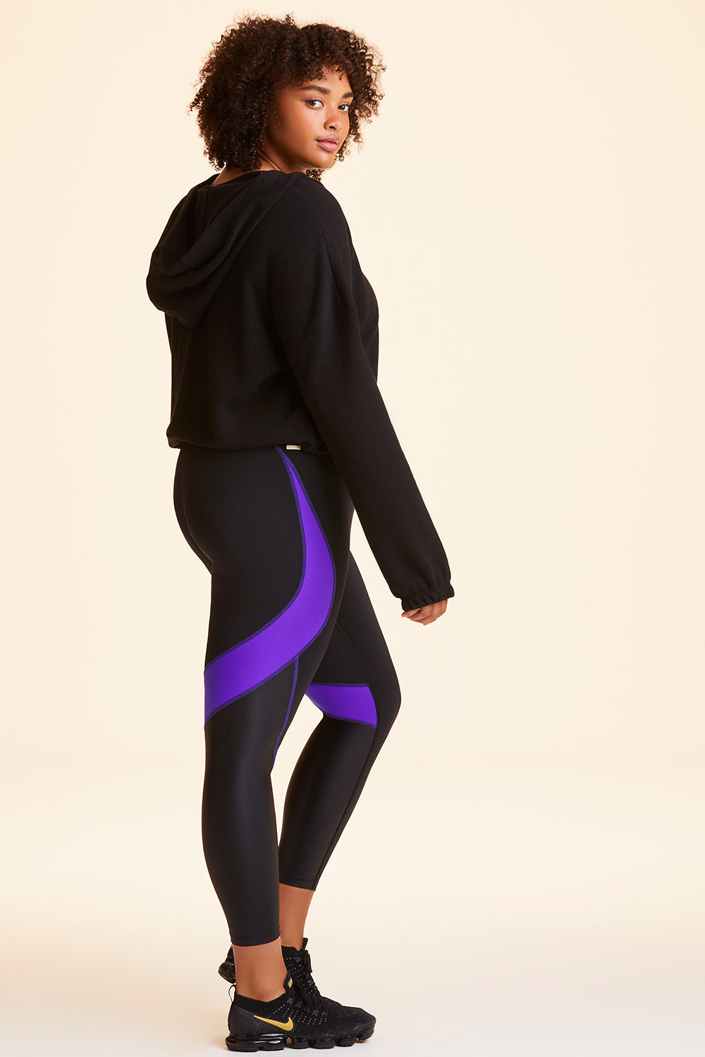 Side  view of Alala Women's Luxury Athleisure black cropped sweatshirt in plus size