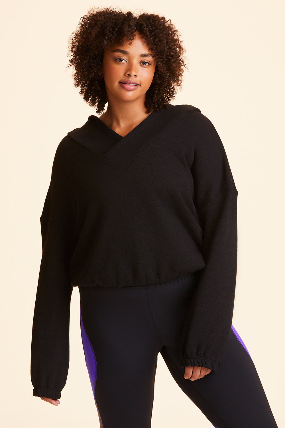 Front view of Alala Women's Luxury Athleisure black cropped sweatshirt in plus size