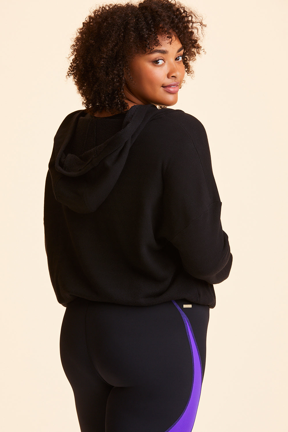 3/4 back view of Alala Women's Luxury Athleisure black cropped sweatshirt in plus size