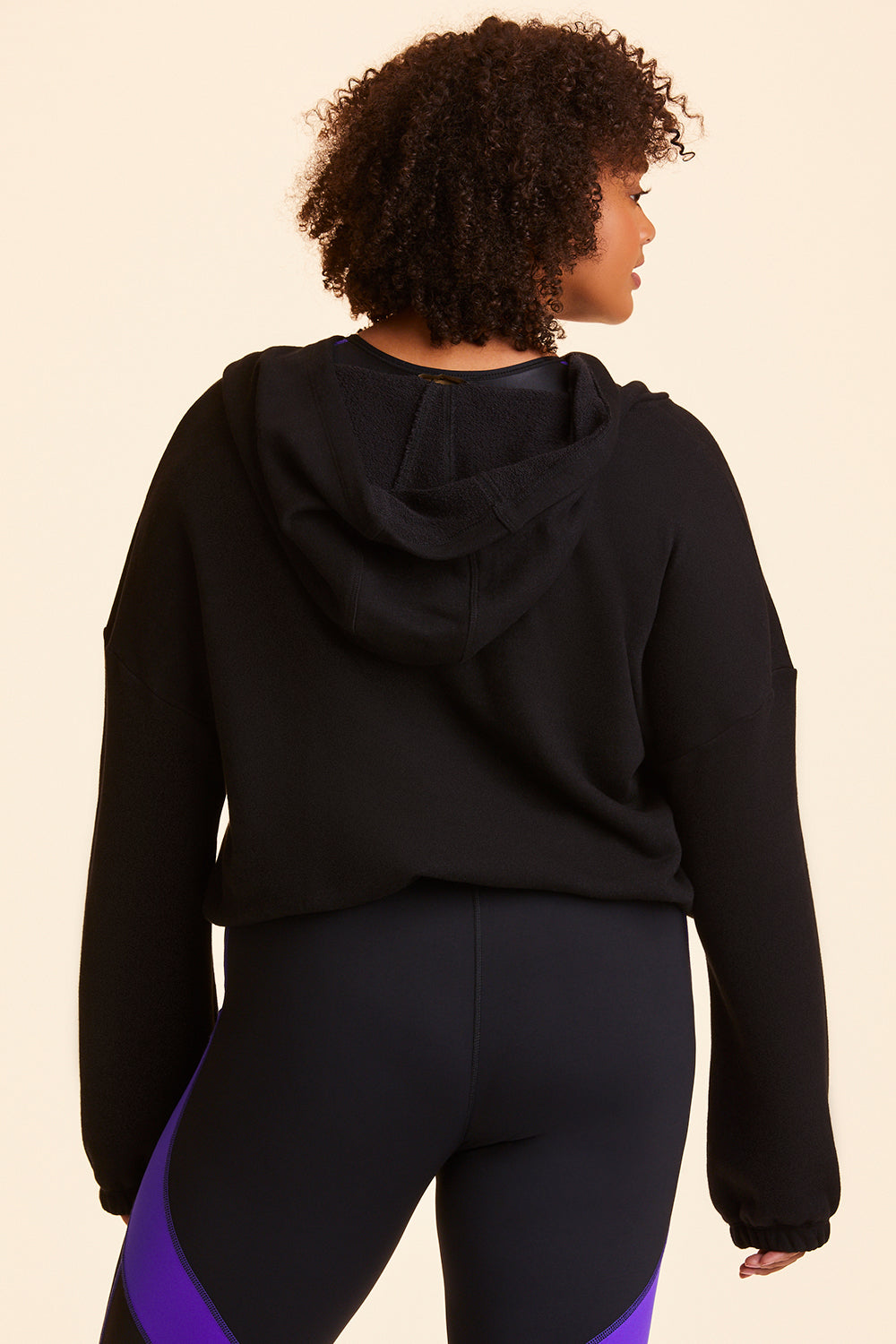 Back view of Alala Women's Luxury Athleisure black cropped sweatshirt in plus size