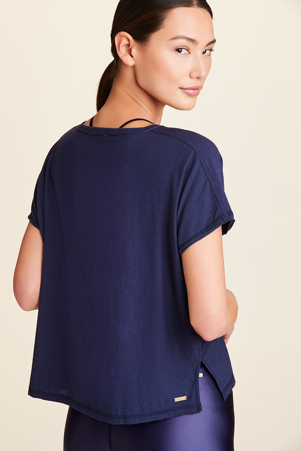 Back view of Alala Women's Luxury Athleisure super-soft tee in solid Navy