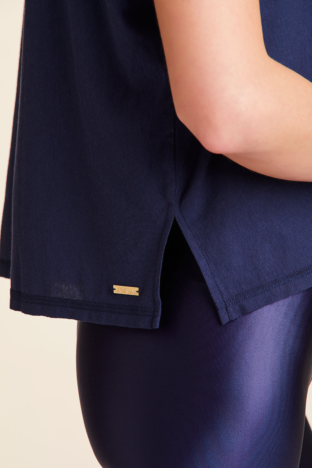 Side detail of Alala Women's Luxury Athleisure super-soft tee in solid Navy