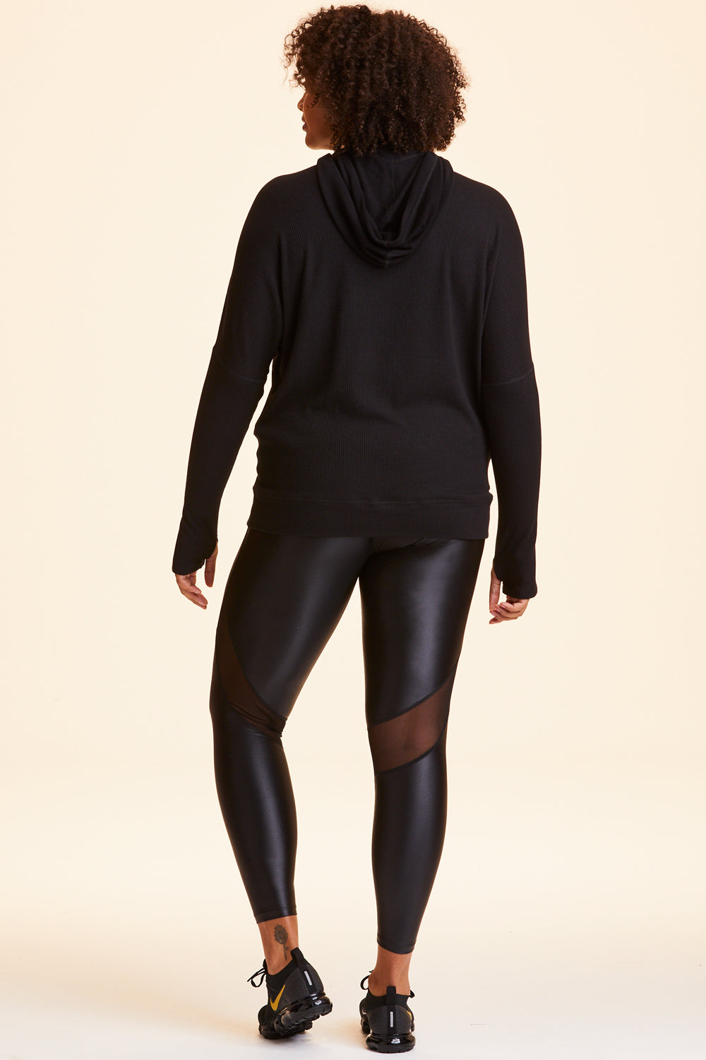 Back view of Alala Women's Luxury Athleisure black hoodie