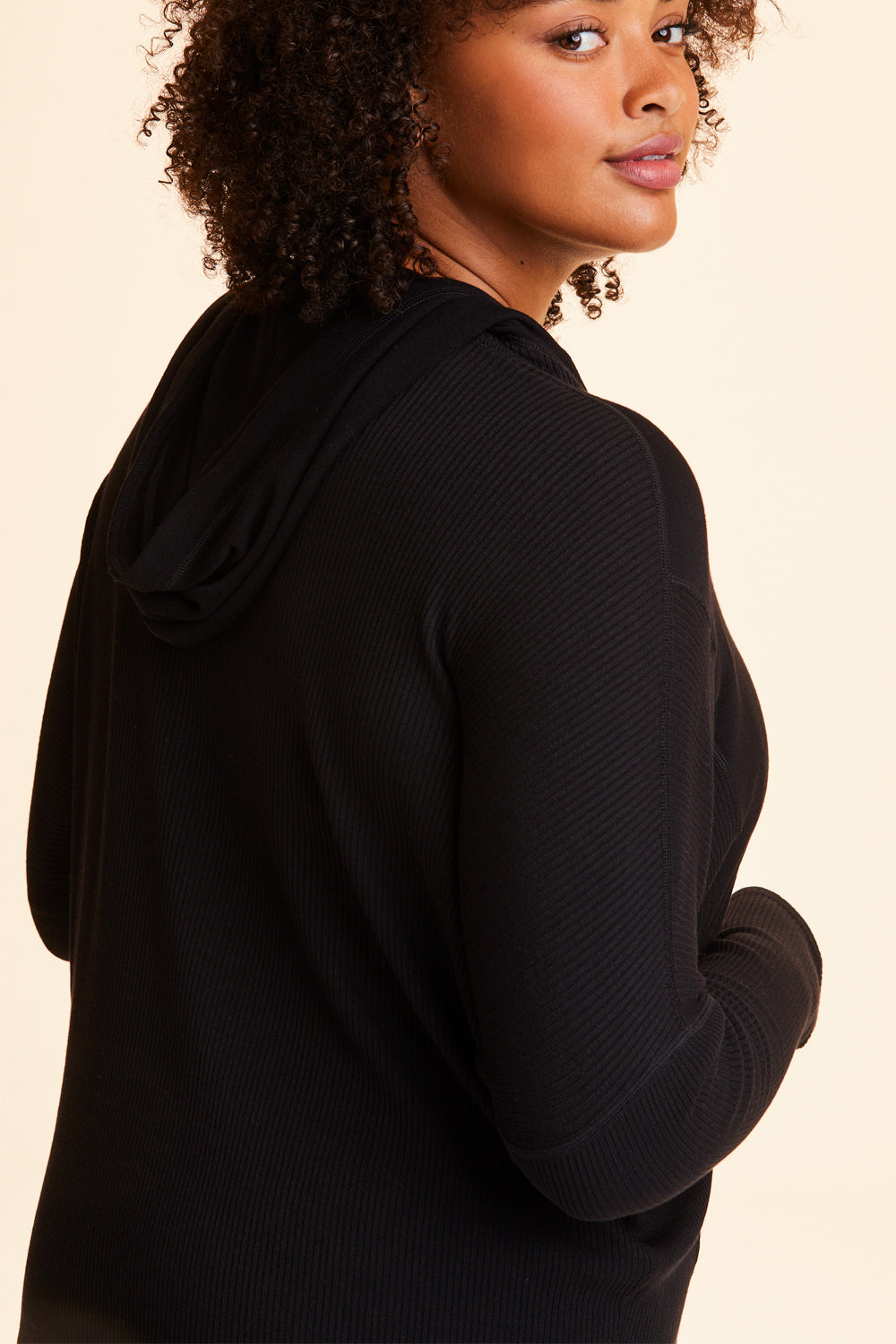 3/4 back view of Alala Women's Luxury Athleisure black hoodie in plus size