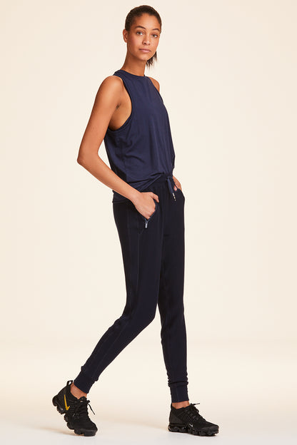 Side view of Alala Women's Luxury Athleisure navy sweatpant