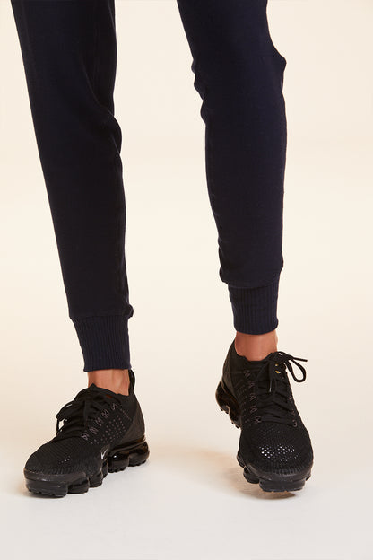 Front  view of Alala Women's Luxury Athleisure navy sweatpant