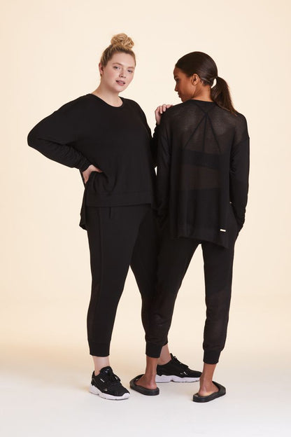 Front and back view of Alala Women's Luxury Athleisure black crewneck sweatshirt