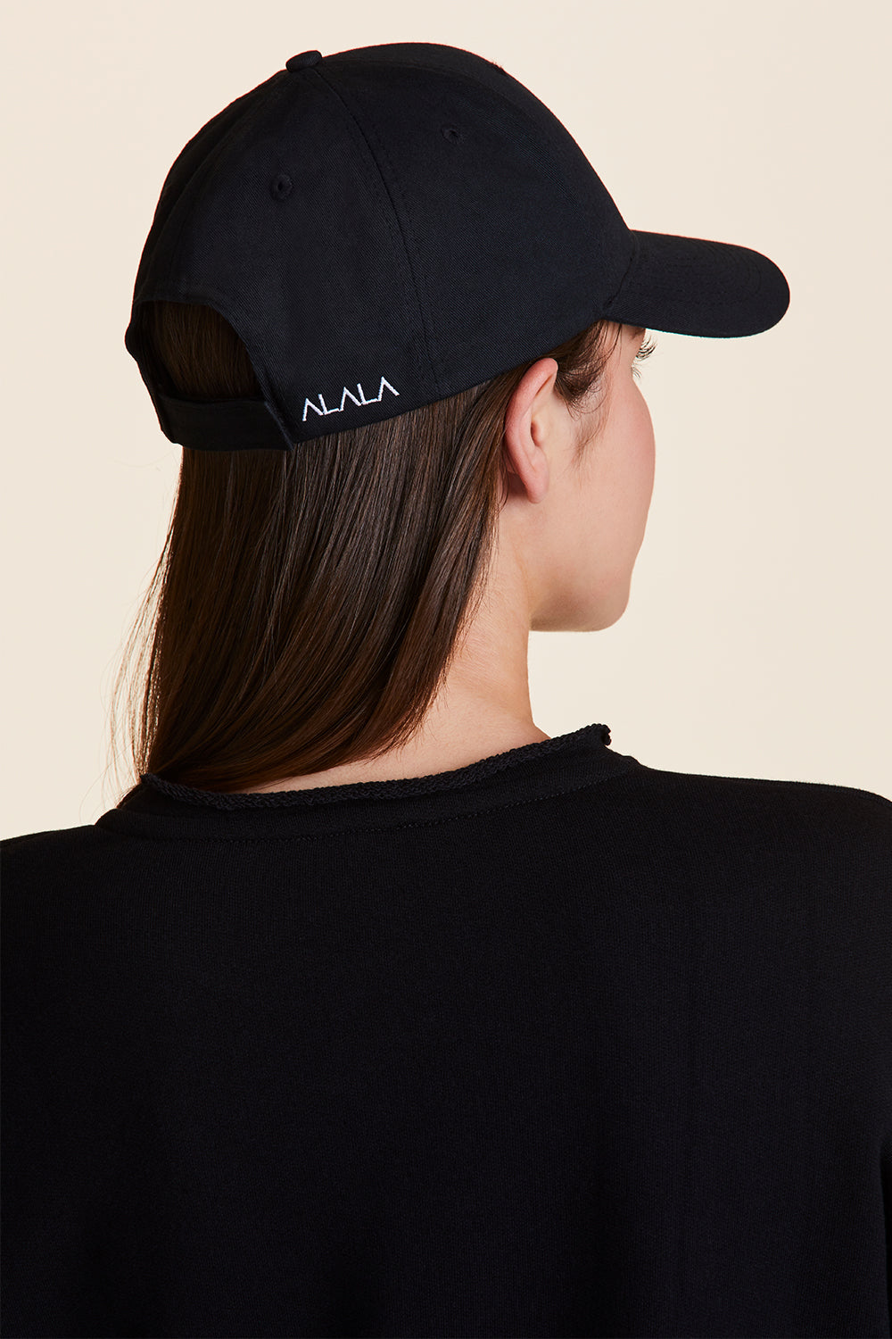 Back view of Alala Women's Luxury Athleisure all day baseball cap in black