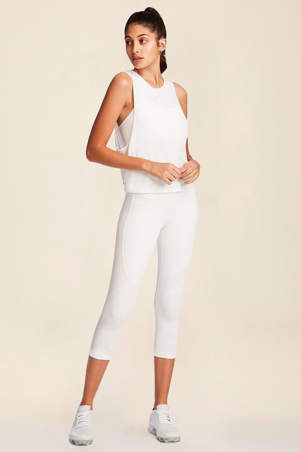 Front full body view of Alala Women's Luxury Athleisure mesh tie back tank in white